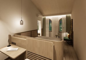 Un interior moderno con un banco de madera, una pequeña mesa con un libro y una ventana con cortinas.