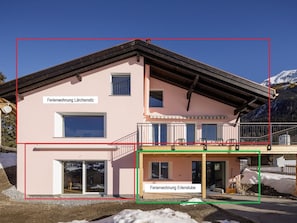 A two-story building with a balcony on the upper floor. - Guarda Val Müller Erlenstube Wohnung Erlenstube Wohnung Erlenstube by Interhome (Lantsch)