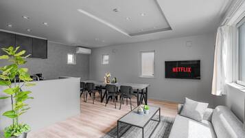 Apartment | Living area | 50-inch flat-screen TV with digital channels