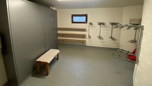 A locker room with benches, a bench, a window, and a shower area. - Casa Surselva Whg Marti Appartement/Fewo, Bad, WC, 2 Schlafräume by Interhome (Savognin)
