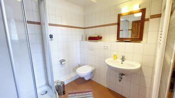 Shower, towels, soap, toilet paper