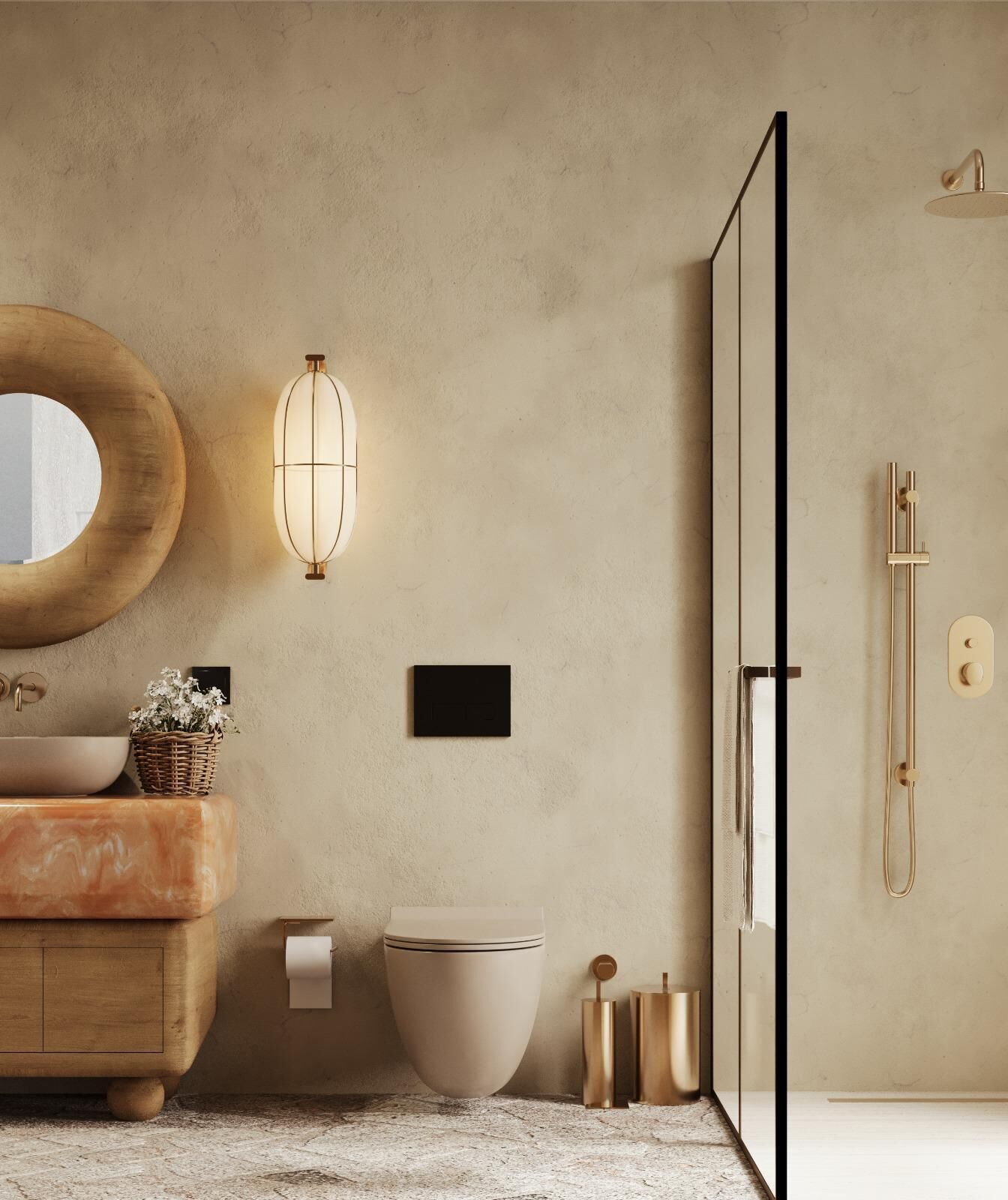 Un baño moderno con un espejo redondo, un lavamanos sobre encimera, un inodoro y una zona de ducha.