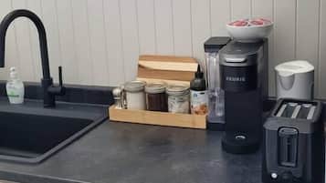 Coffee/tea maker, fridge, microwave, cookware/dishes/utensils