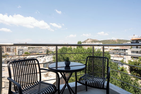 Apartamento superior | Restaurante al aire libre