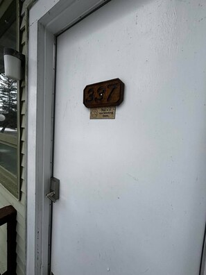 A door with a number plate marked '337' and a sign stating 'This is a non-smoking room.'