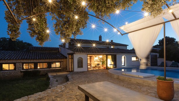 A house with a stone exterior, a swimming pool, and string lights. - La Sardagne | Charming House in the Heart of the Garrigue, Near Vallon-Pont-d'Arc (Bourg-Saint-Andéol)