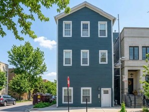 A two-story building with a flat roof and a symmetrical facade. - Peaceful Boho Retreat | Free Private Parking (Chicago)