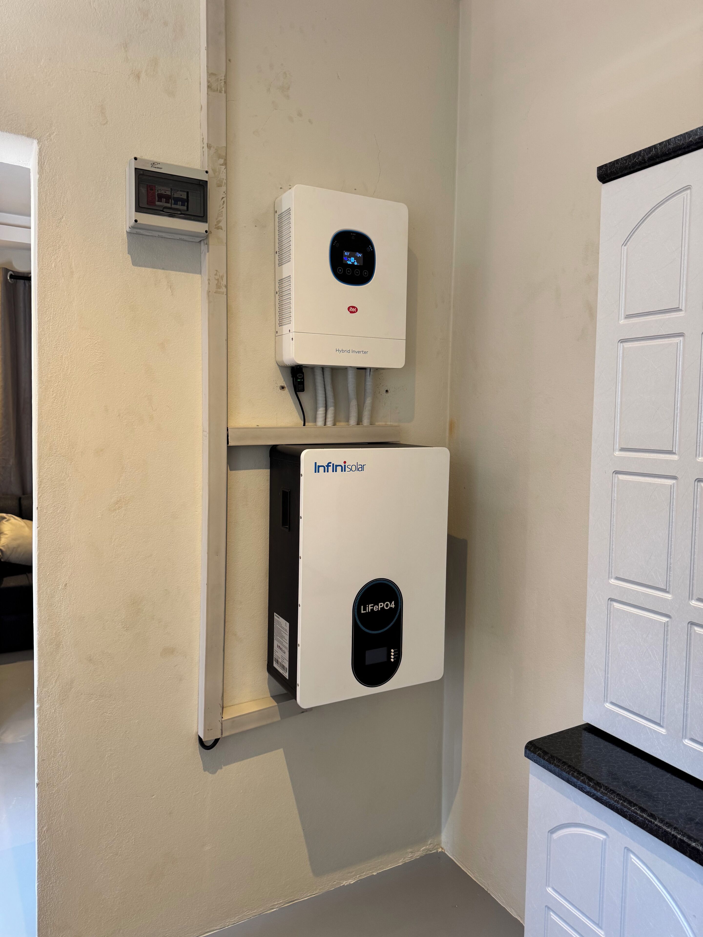 A wall-mounted heating unit with a digital display and a control panel below it.
