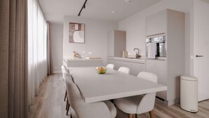 A modern kitchen with a white countertop, a built-in oven, and a sink. - 2BR Rooftop Terrace in Rotterdam City Centre (Rotterdam)