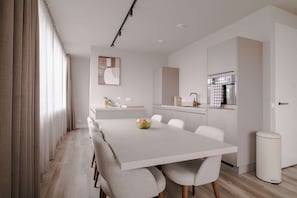 A modern kitchen with a white countertop, a built-in oven, and a sink. - 2BR Rooftop Terrace in Rotterdam City Centre (Rotterdam)