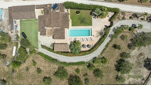 An aerial view of a residential property with a swimming pool, tennis court, and a landscaped garden. - Villa Sa Xabola - Three Bedroom Villa, Sleeps 6 (Can Tabou)