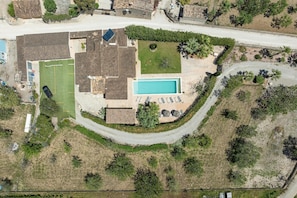 An aerial view of a residential property with a swimming pool, tennis court, and a landscaped garden. - Villa Sa Xabola - Three Bedroom Villa, Sleeps 6 (Can Tabou)