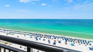 A beach with numerous umbrellas and people. - Sundestin 1409 (Destin)