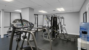 A gym with cardio machines, weight training equipment, and a water dispenser. - Sundestin 1409 (Destin)