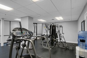 A gym with cardio machines, weight training equipment, and a water dispenser. - Sundestin 1409 (Destin)