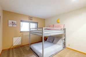 A bunk bed with a moon decoration, a window, and a wall art piece. - Fraser Condo w/ Pool & Hot Tubs: Close to Trails! (Fraser)