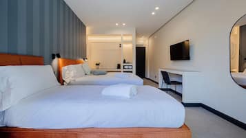 Luxury Triple Room, Balcony, Garden View | In-room safe, desk, laptop workspace, blackout curtains