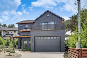 A two-story house with a garage, a covered porch, and a landscaped front yard. - Pool & Lake Access! Dual Homes on Canyon Lake (Canyon Lake)