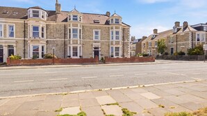 A row of terraced houses with a clear street in front. - Sunset Views - North East Escapes (Tynemouth)