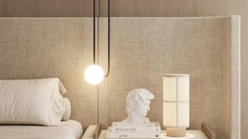 A bedroom with a bed, bedside table, lamp, and a bust sculpture.