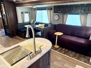 Living area - Peaceful 2-bedroom waterfront camper, gated community in charming Decaturville (Decaturville)