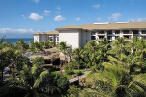 A hotel with multiple floors, a pool area, and lush greenery. - 1 Bedroom Villa at Westin Nanea Ocean Resort (Lahaina)