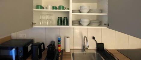 Coffee/tea maker, fridge, microwave, oven