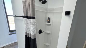 Shower, towels, soap, toilet paper