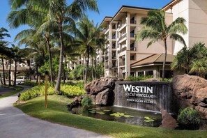 A Westin Vacation Club with a waterfall feature, palm trees, and a well-maintained lawn. - 3 Bedroom Villa at Westin Nanea Ocean Resort (Lahaina)