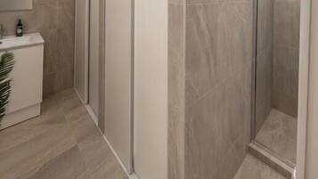 Shower, hair dryer (on request), towels, toilet paper