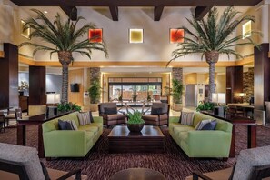 A spacious lobby with a central seating area, two palm trees, and a view of the outside. - 2 Bedroom Villa at Scottsdale Resort Kid-Friendly (Scottsdale)