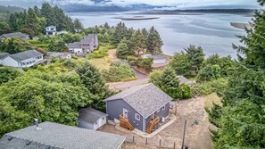 A residential area with houses, a dock, and a body of water.