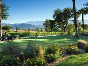A golf course with a clear sky, mountains in the background, and well-maintained greenery. - 2 Bedroom Villa at Westin Mission Hills Resort (Rancho Mirage)