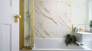Combined shower/bathtub, deep-soaking bathtub, hair dryer, towels