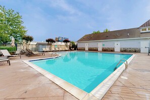 A rectangular swimming pool with a tiled deck surrounding it. - Rehoboth Crossing - 36983 Grindstone Ln. (Rehoboth Beach)