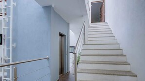 A staircase with a handrail leading to an upper floor. - Family oasis near the sea - La Cruz Encantada 3B (La Cruz de Huanacaxtle)
