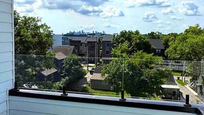 A residential area with houses, trees, and a clear sky with clouds. - Velvet Note@ The New Cumberland Side B (Nashville)