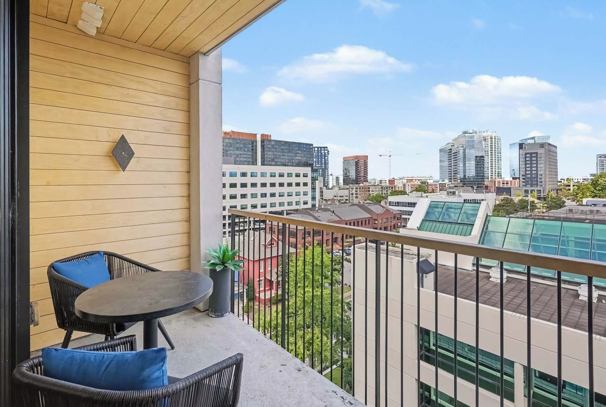 Sip your morning coffee high above the city on this private balcony, with seating for four and skyline views that set the tone for a night on the town.