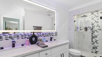 Shower, hair dryer, towels, shampoo