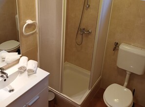 A bathroom with a shower, toilet, and sink. - Superior Two Bedroom Apartment with Sea View and Terrace (Rab)