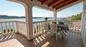 Outdoor dining - Superior Two Bedroom Apartment with Sea View and Terrace (Rab)