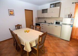 Dining - Superior Two Bedroom Apartment with Sea View and Terrace (Rab)
