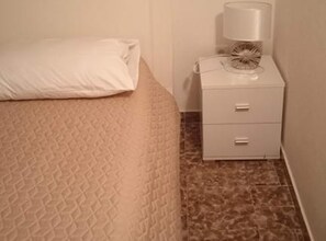 A bedroom with a bed, a nightstand, and a lamp. - Two Bedroom Apartment with Sea View and Terrace (Rogoznica)