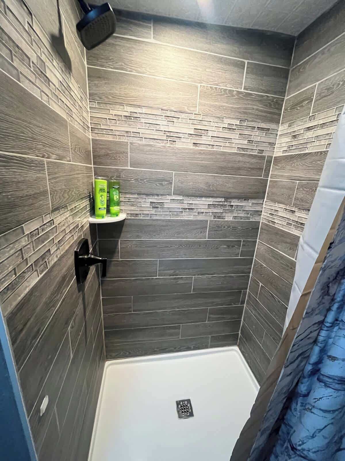 Shower, hair dryer, towels, shampoo