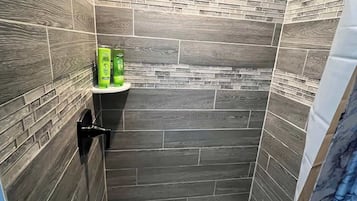 Shower, hair dryer, towels, shampoo