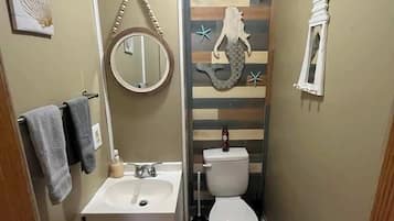 Shower, hair dryer, towels, shampoo