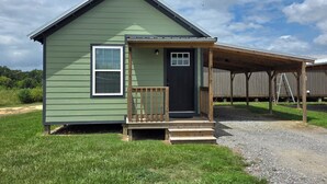 A small, single-story house with a front porch and a door. - The Crappie Cabin #5
When a tent just won't do! (Abbeville)