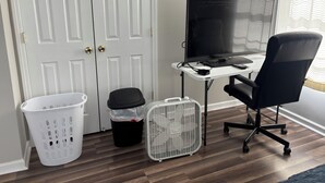 A room with a desk, computer, office chair, white laundry basket, trash bin, and a white fan. - A 2-story, 3-bedrooms, 2.5 bathrooms with 3 hospitals that are 1 - 25 miles away (Lowville)