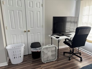 A room with a desk, computer, office chair, white laundry basket, trash bin, and a white fan. - A 2-story, 3-bedrooms, 2.5 bathrooms with 3 hospitals that are 1 - 25 miles away (Lowville)