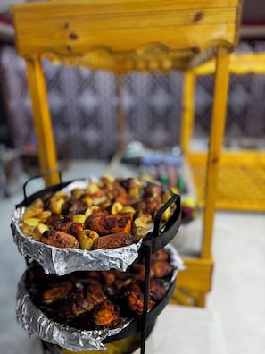 A grill with various meats and vegetables.